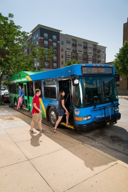 people getting on the bus
